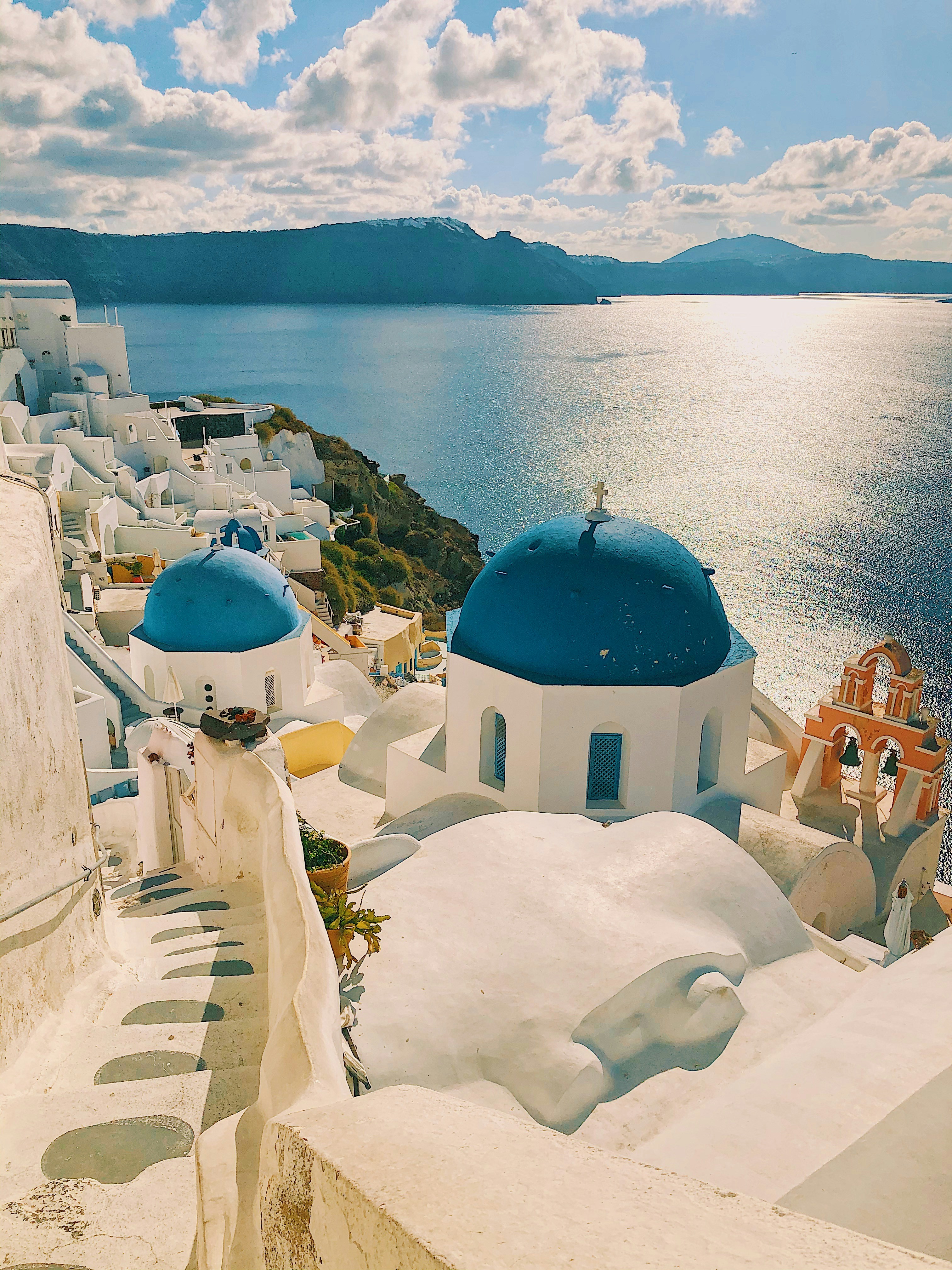 Whitewashed houses above the deep blue sea in Greece